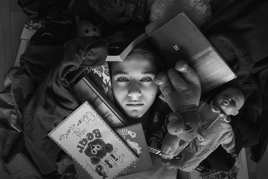 a girl's face is surrounded by clutter